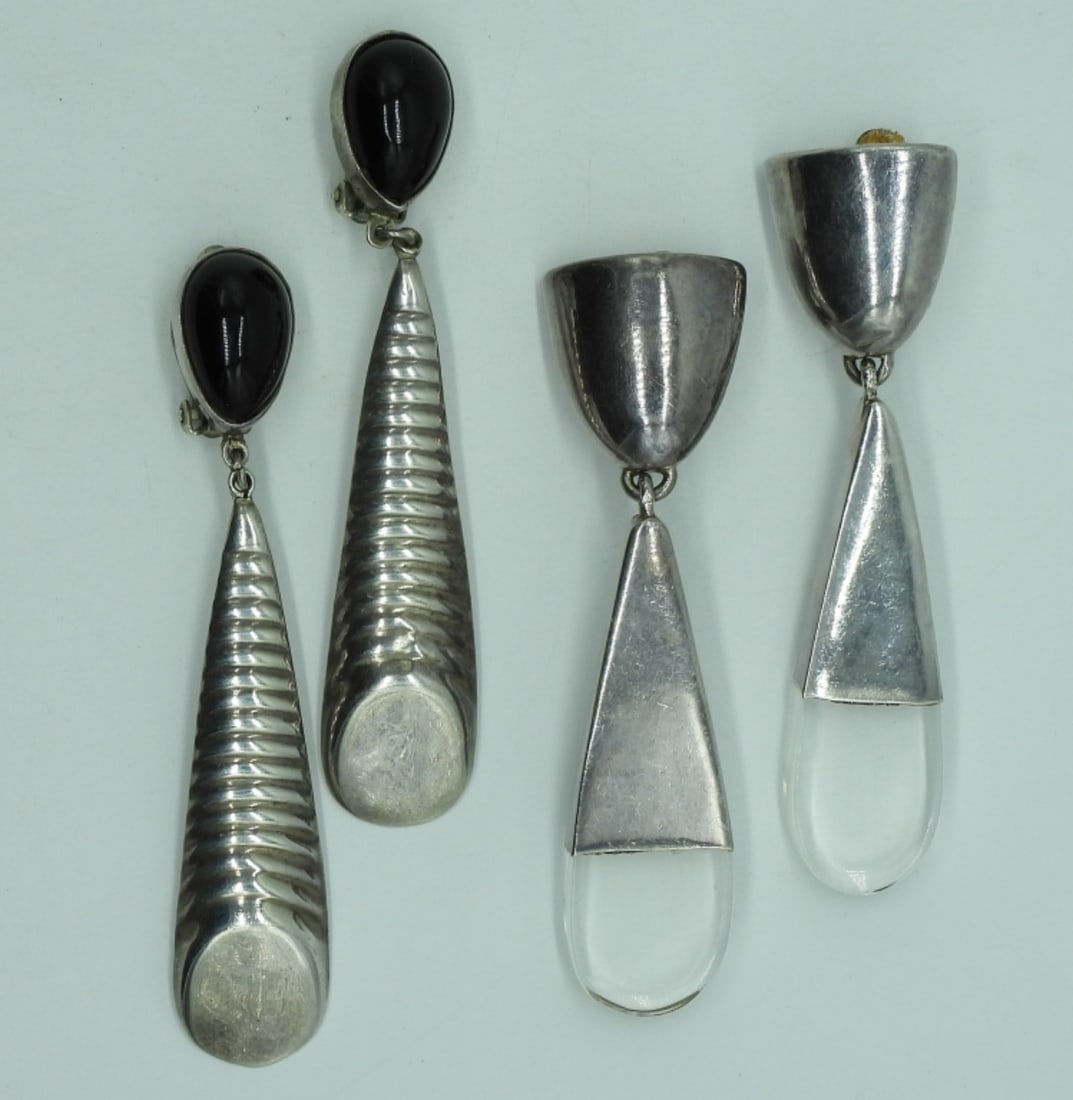 Two Pair Vintage Sterling Clip On Earrings: Two pair of vintage sterling clip on earrings. Black Onyx gemstoned pair are Taxco Mexico, 3.5" long. Other clip on pair of sterling earrings are 3.5" long. (28 dwt) ((6x4x2)