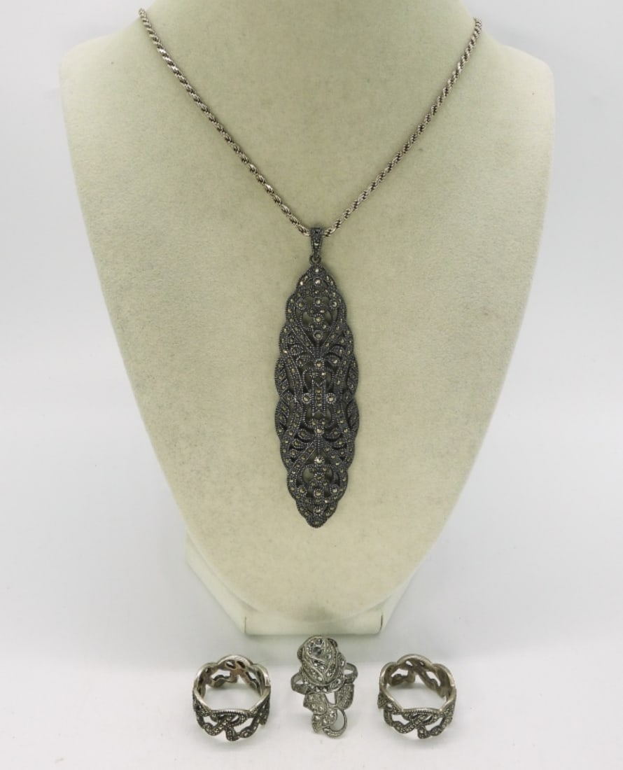 Marcasite 925 Necklace & Rings: Three sterling marcasite rings, size 9. Vintage sterling marcasite pendant, 3.5" long. Sterling chain is 18". (24.6 dwt) (6x4x2)