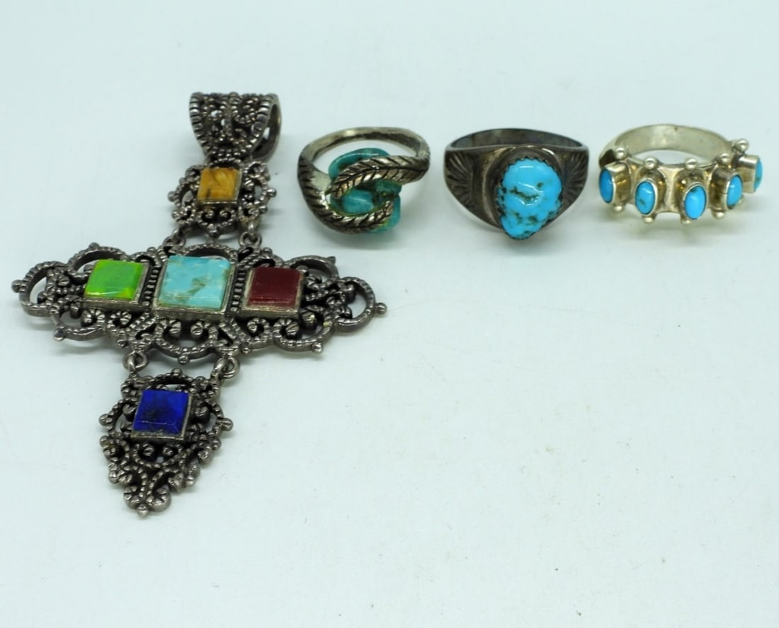 Vintage Turquoise Rings and Cross Pendant: Three sterling turquoise rings, sizes 5 - 7.5. Sterling gemstone cross pendant, linked together, 3" long. (18 dwt)