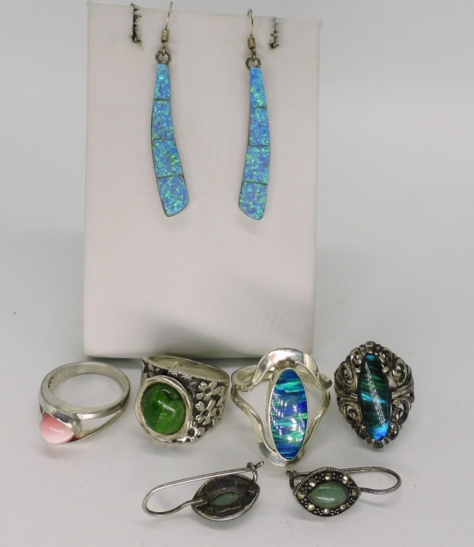 Opal, Cats Eye, Jade Rings & Earrings: Four sterling rings with gemstones. Sizes 5, 6, 7, 9.5. Two pair pierced earrings, 1-2" long. (20 dwt)