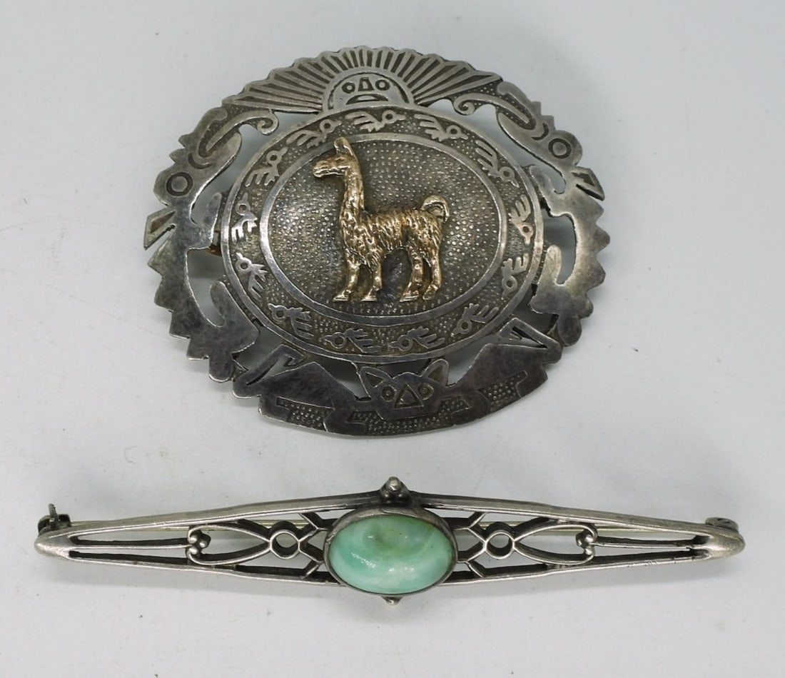 Peruvian & Art Deco Sterling Brooches: Two sterling brooches, 1 3/4" & 2". Llama brooch is marked "Peru 925 18k". Art Deco green stone brooch is marked "Sterling". (11 dwt)