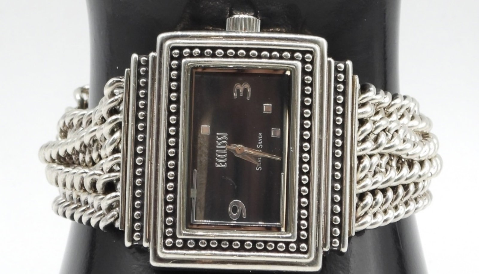 Ecclissi Sterling Silver Women's Watch 30DWT: #33612, Sterling silver case, Stainless Steel. The watch face seems to be missing the sterling squares. Watches are not verified, authenticated, or tested in running condition unless specified.