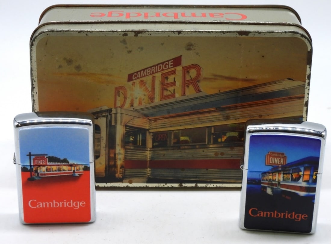 Cambridge Diner Zippo Tin Set Unfired 1996: Unfired, the seal is broken. They come in their original tin case (case has some wear from the years). 1996