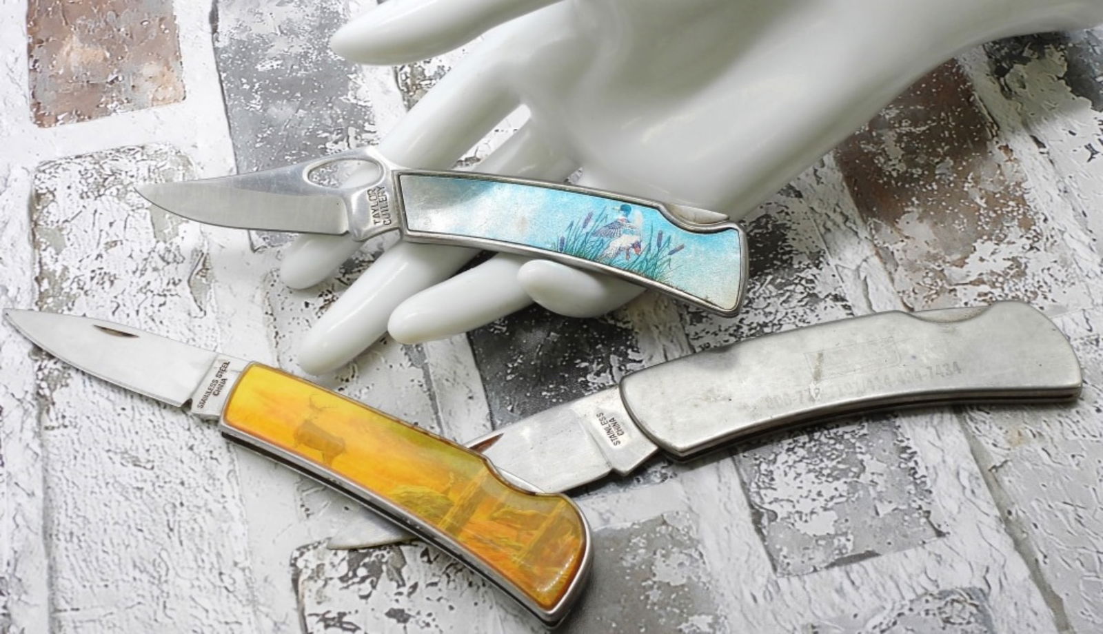 (3) Single Blade Pocket Knives: 1) Decorative deer handle. 2) Decorative Duck Handle. 3) Monroe and two phone numbers on the handle.