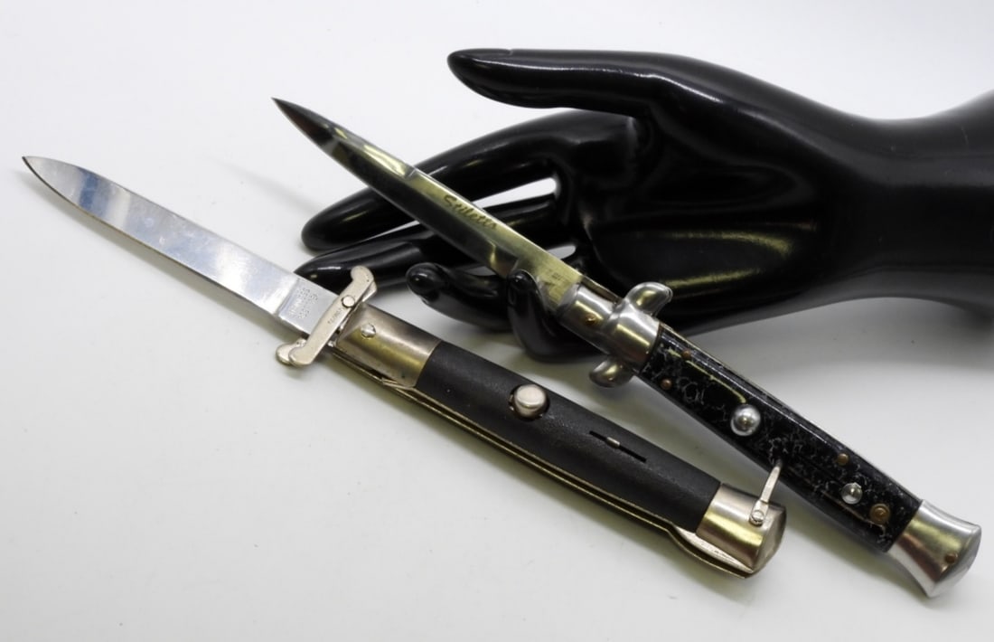 (2) Spring Assisted Switch Blades: 1) Rostfrei with a black handle and a textured grip. 2) Stiletto