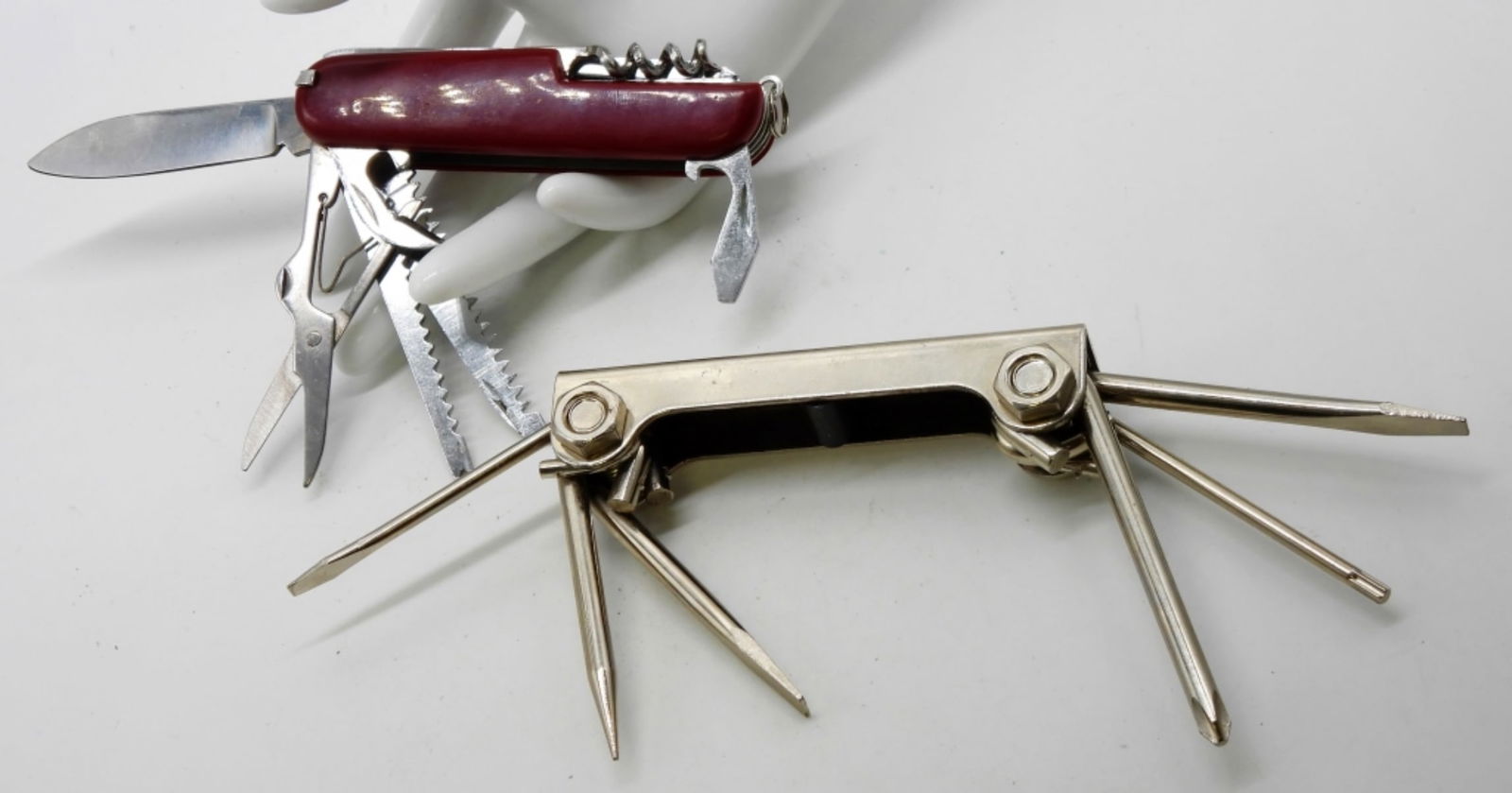 (2) Multi-Tools: 1) A twelve-tool pocket knife. 2) Six screwdrivers in one