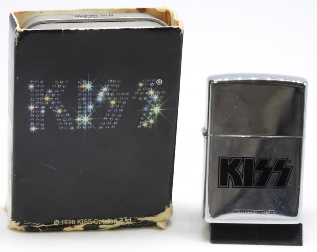 2000 Kiss Logo Zippo Sealed: Sealed. In its original tin case and sleeve (sleeve is worn from the years)