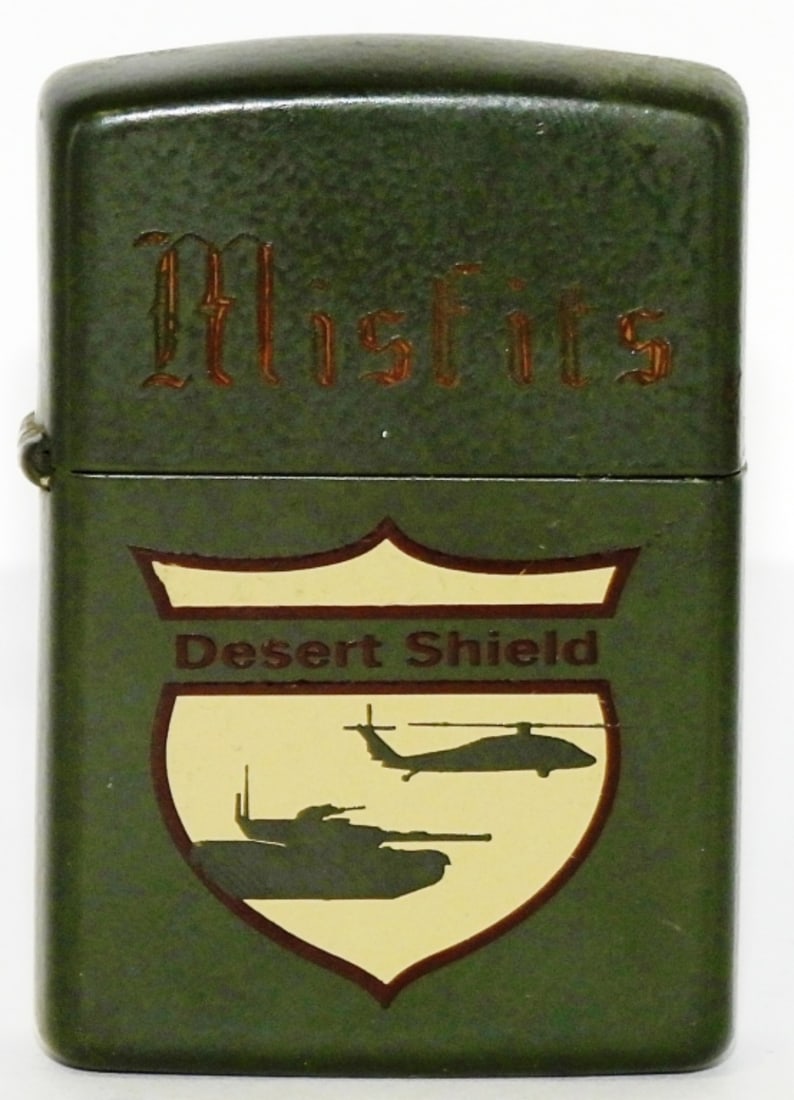 1990 Desert Shield Zippo Fired: Zippo has been fired. 1990 Engraved Misfits on the top. Does not have a box