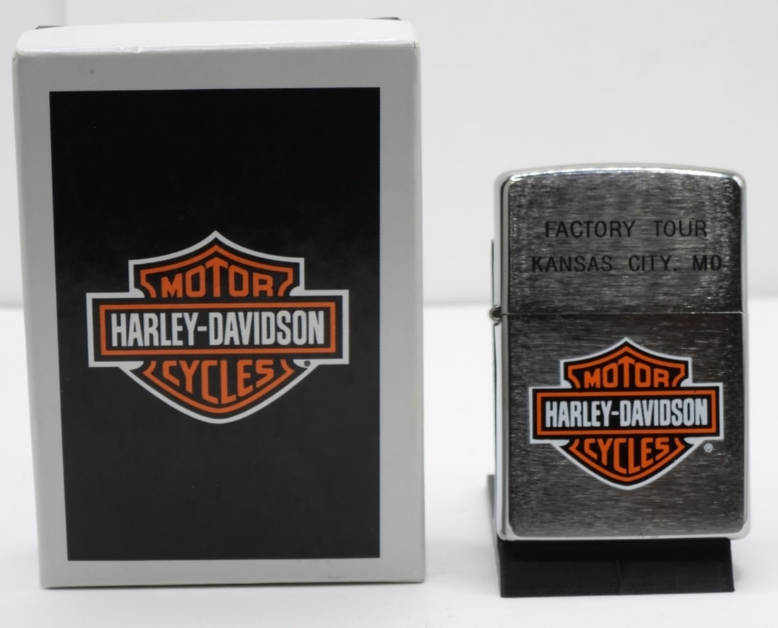 Harley-Davidson Factory Tour Zippo Unfired: 2009. Engraved at the top: Factory Tour, Kansas City, MO. Comes in its original box.