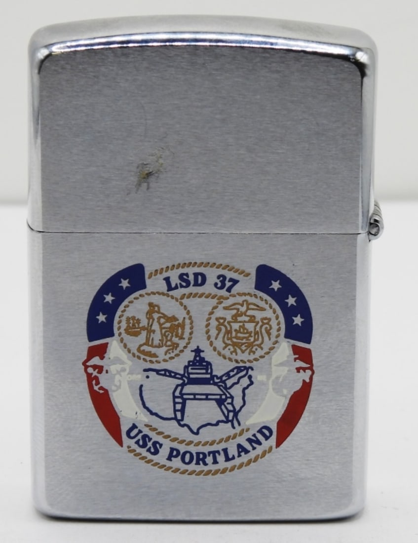 U.S.S Portland LSD-37 Zippo 1989 Unfired: Unfired. Does not come in a box. Ship on the front of the Zippo. LSD 37 USS Portland logo on the back