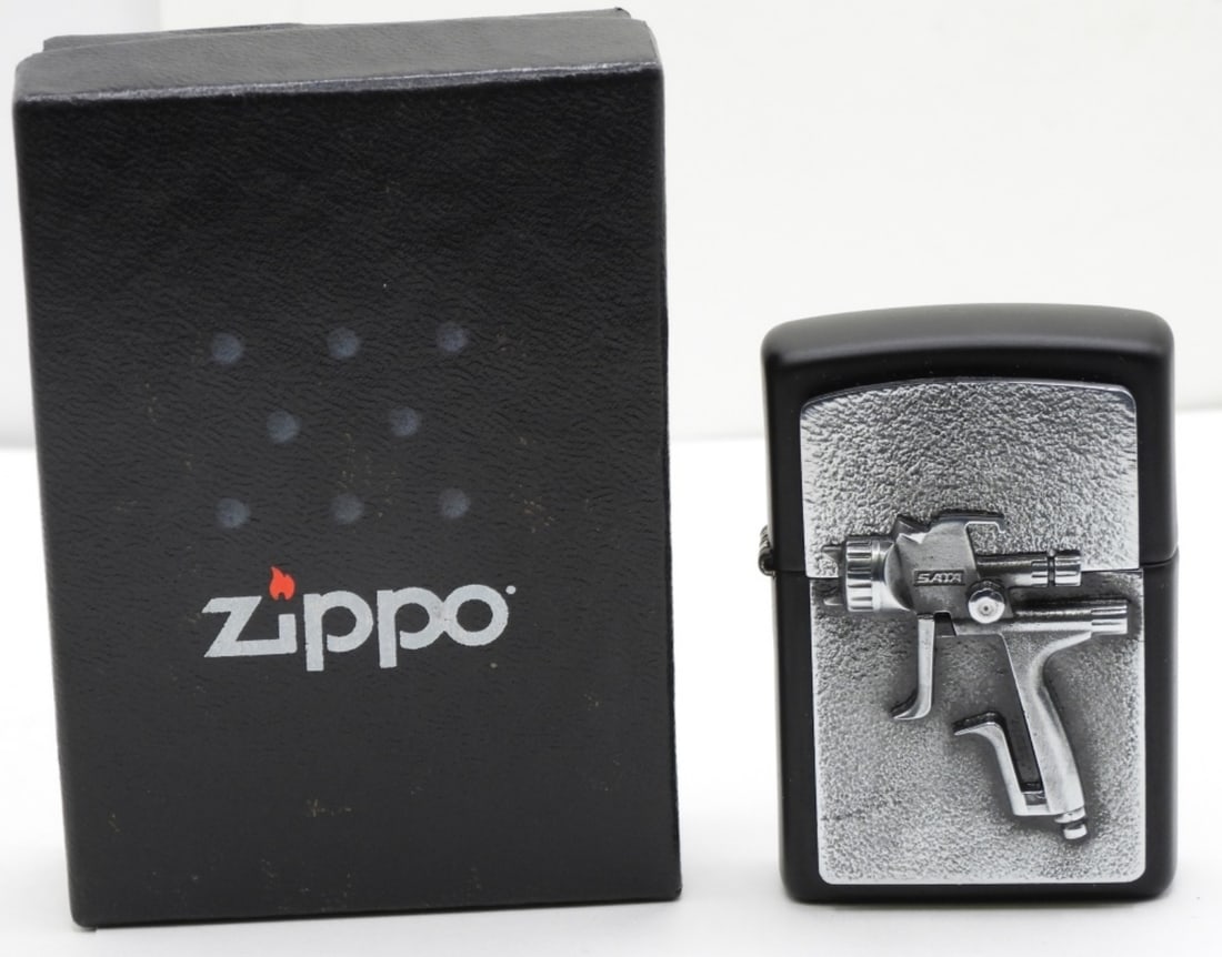 Sata Spray Gun Zippo 2023 Unfired: Unfired. Comes in its original box. Spray gun has a 3d effect on the top.