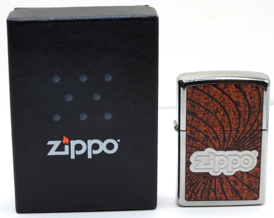 2009 Zippo Logo Spiral Sealed: Sealed. Logo on the front. Come in it original box.