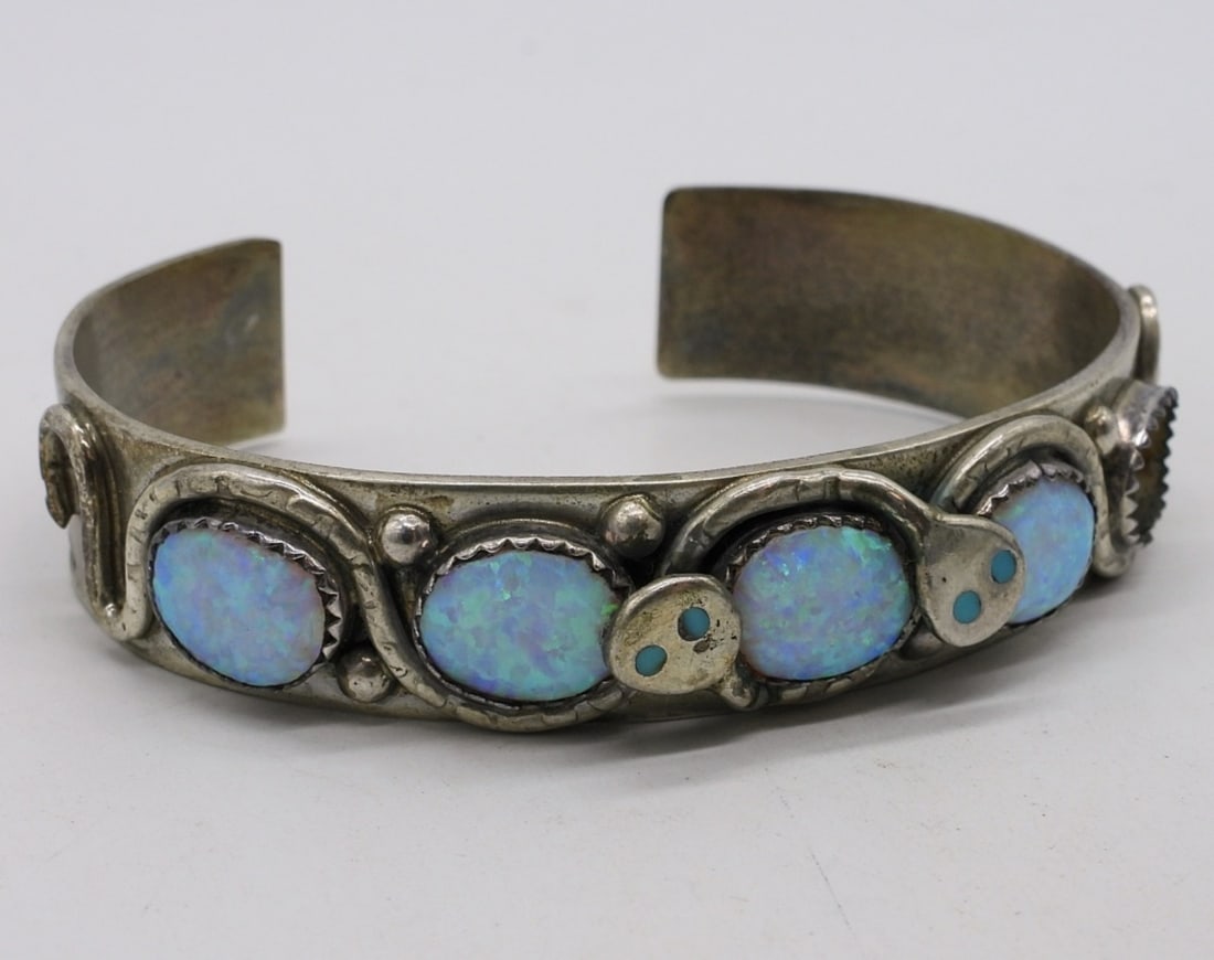 Effie C Snake Cuff with Opal Gemstones: "Effie C" snake cuff bracelet with Opal & Turquoise gemstones, missing one gemstone. Still a beautiful piece of jewelry! (16.5 dwt)