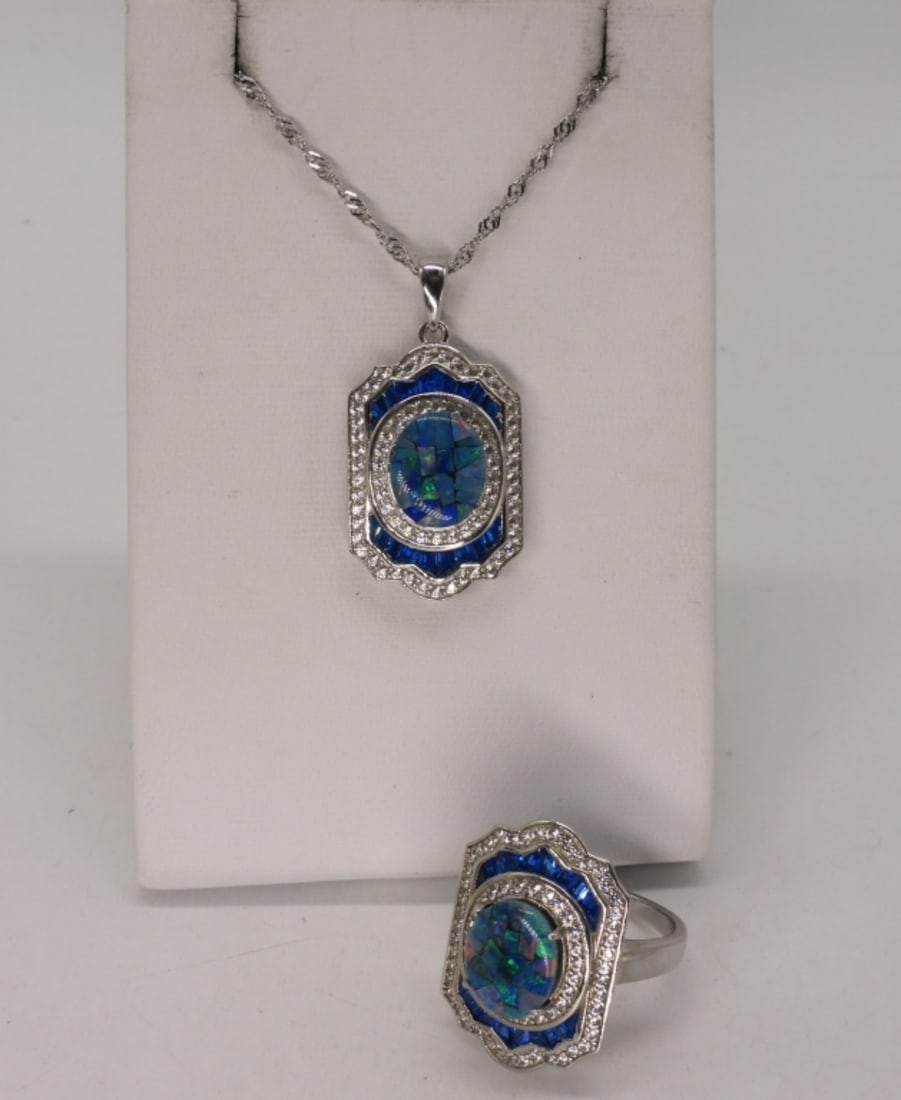 Opal Sterling Matching Necklace & Ring Set: Sterling matching set, with Opal centers and blue and white surrounding simulated stones. Necklace is 20" long. Ring size 7. (9 dwt)