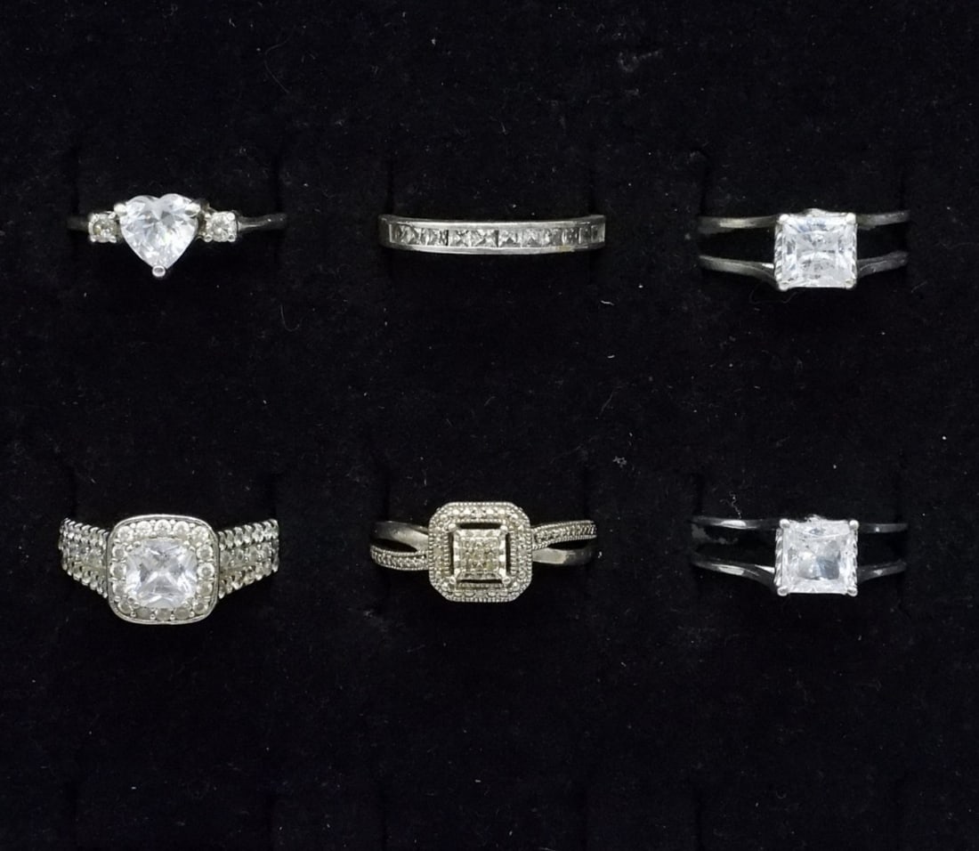 6 Sterling Bridal Style Rings: Six sterling rings with simulated diamond gemstones. Sizes 7 & 8. (10 dwt)
