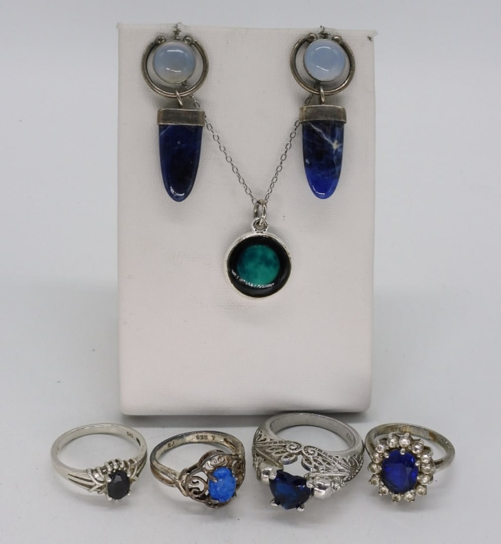 Blue Gemstone Rings, Moon Necklace & More: Four sterling fashion rings with blue gemstones, sizes 6-9. Pierced earrings, 1.5" long. Moon necklace, 18" long. (16.8 dwt)
