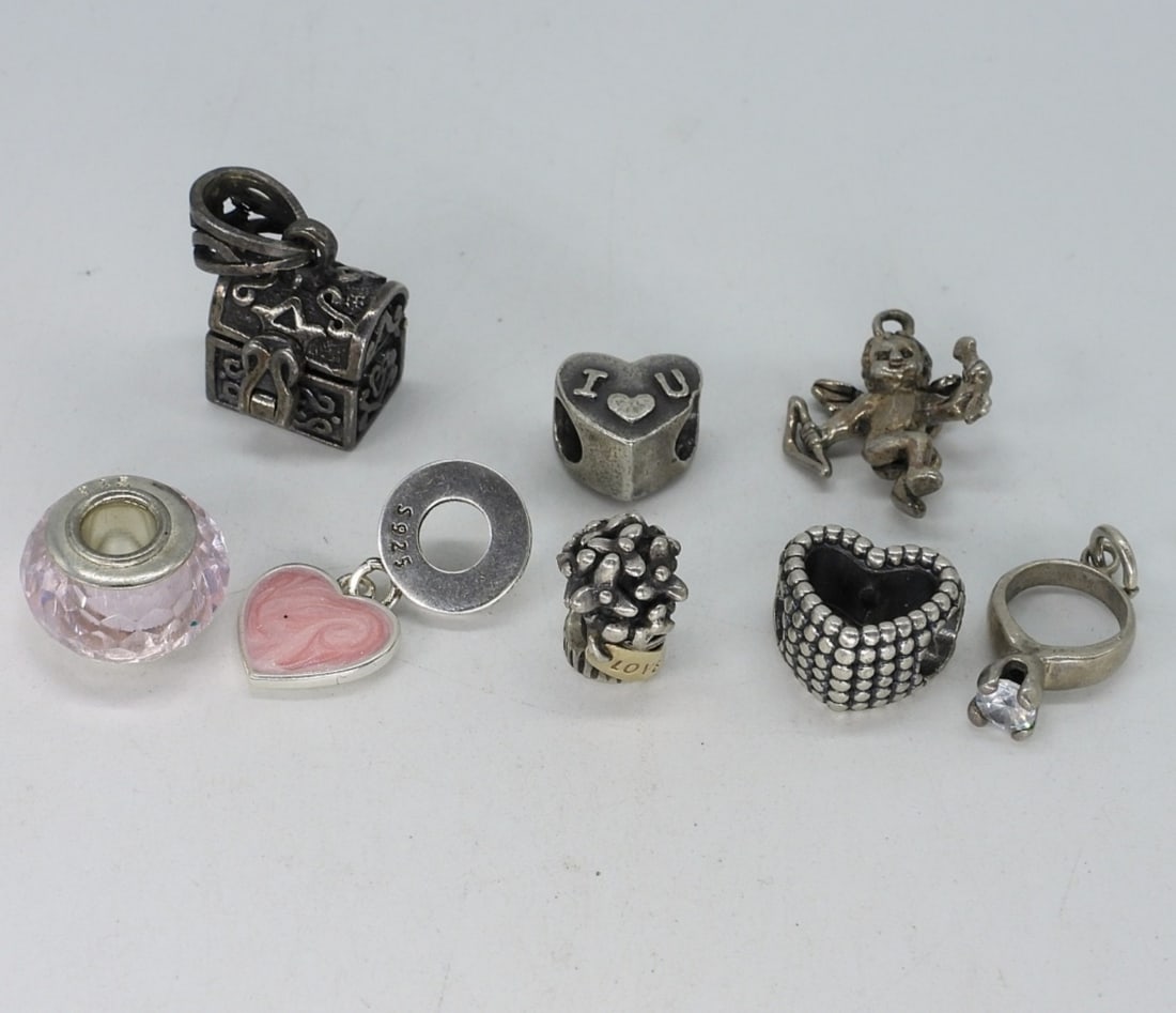 8 Sterling Modern Charms: Eight sterling modern charms, fits pandora style bracelets. (13 dwt)