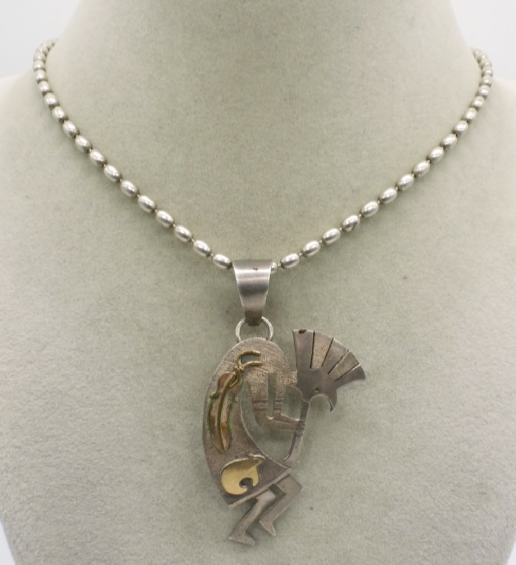 Sterling 12K G.F. Kokopelli Necklace: Sterling Kokopelli pendant with 12k gold filled accents. Pendant is 2.5" long on a 16" sterling chain. Marked "1/20 12k gf Sterling". (14.2 dwt)