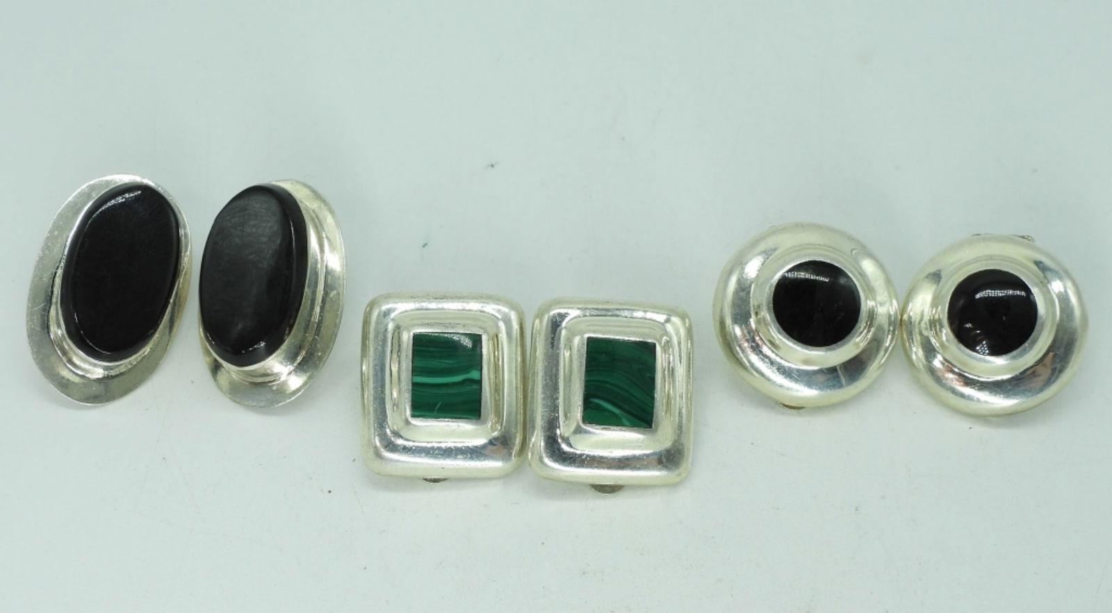 3 Pair of Taxco Sterling Clip On Earrings: Three pair of sterling clip on earrings. All three are Taxco Mexico. Black Onyx and Malachite Gemstones. (24 dwt)