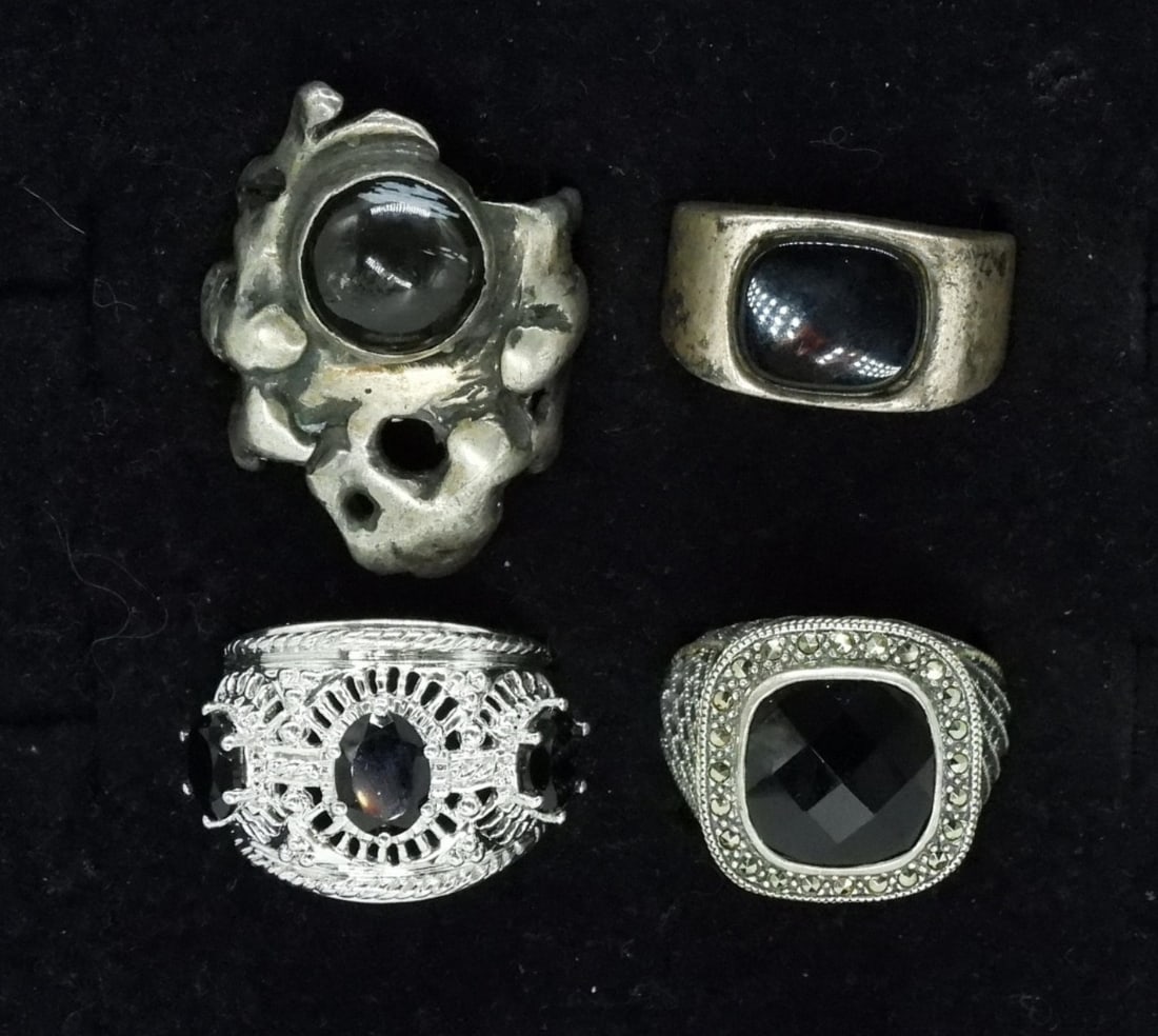 Four Sterling Onyx Gemstone Rings: Four sterling rings with black onyx gemstones. Sizes 6-10 (32 dwt)