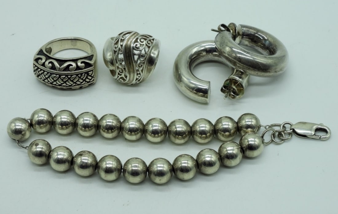 Sterling Beaded Bracelet, Rings & Earrings: One sterling beaded bracelet, 8" long. One pair of pierced sterling hoops, hollow. Two sterling rings, size 6. (25 dwt)