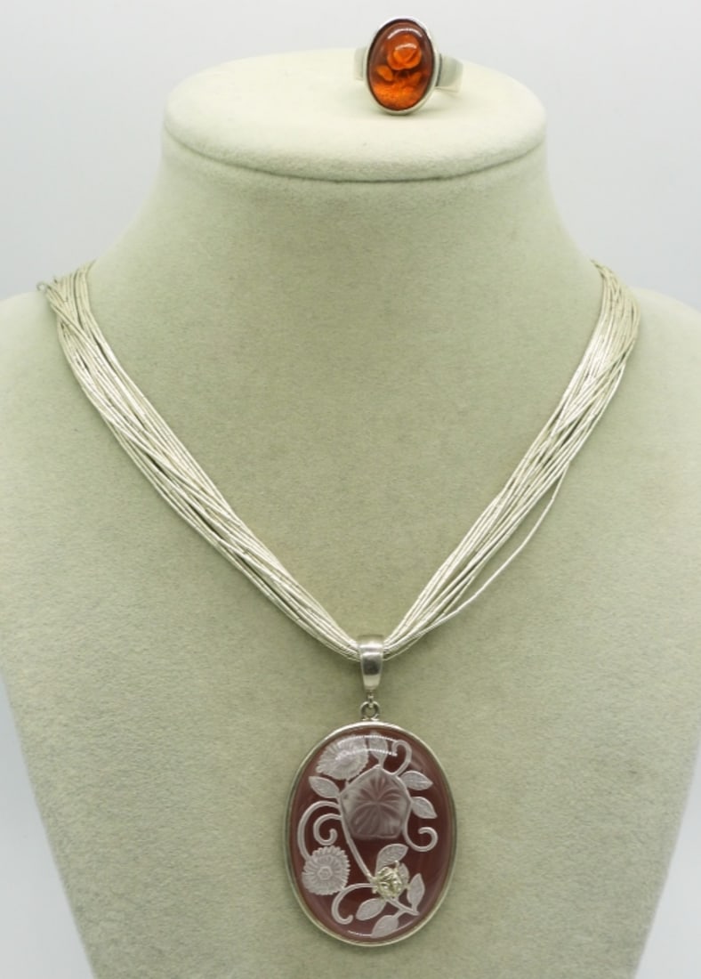 Whitney Kelly Carnelian Ladybug Necklace: Whitney Kelly carnelian (thin layer) etched glass, ladybug pendant (2" long) on a liquid sterling 20" chain. Sterling ring, size 7. (19 dwt)