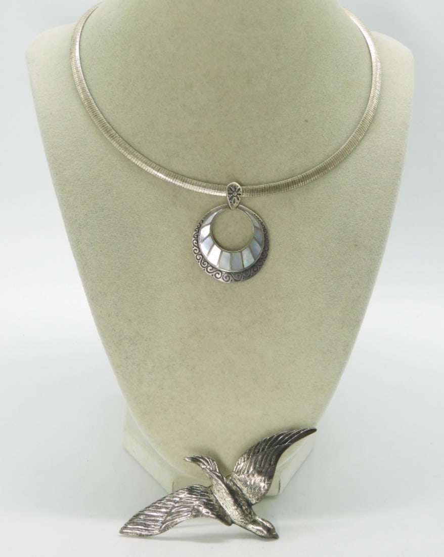 Dane Craft 925 Bird Brooch & Necklace: Dane Craft sterling bird brooch, 3.5" x 2". Mother of pearl inlay sterling pendant (1 3/4") on a 16" sterling chain. (22.1 dwt)