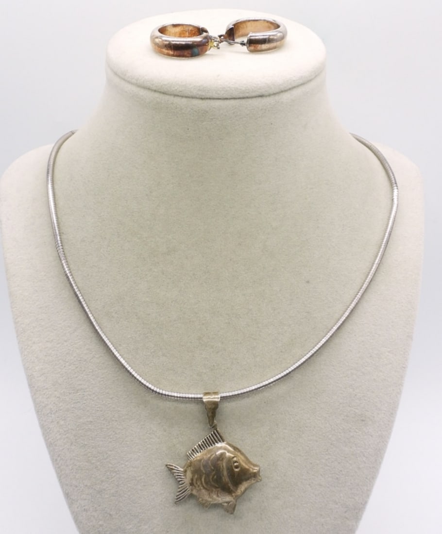 Sterling Fish Pendant & Earrings: Fish pendant 1.5" long, on a 20" sterling chain. One pair of sterling pierced hoop earrings. (12.8 dwt)