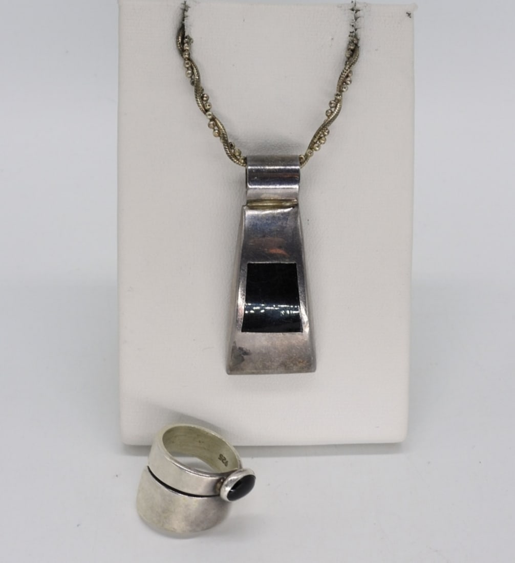 Taxco 925 Black Onyx Necklace & Ring: Taxco Mexico sterling black onyx pendant (1 3/4") on a 18" sterling chain. Black onyx sterling ring, size 5. (20 dwt)
