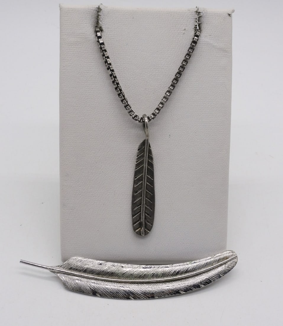 Sterling Feather Necklace & Pin: Sterling feather necklace, 20". Sterling feather pin, 3". (11.6 dwt)