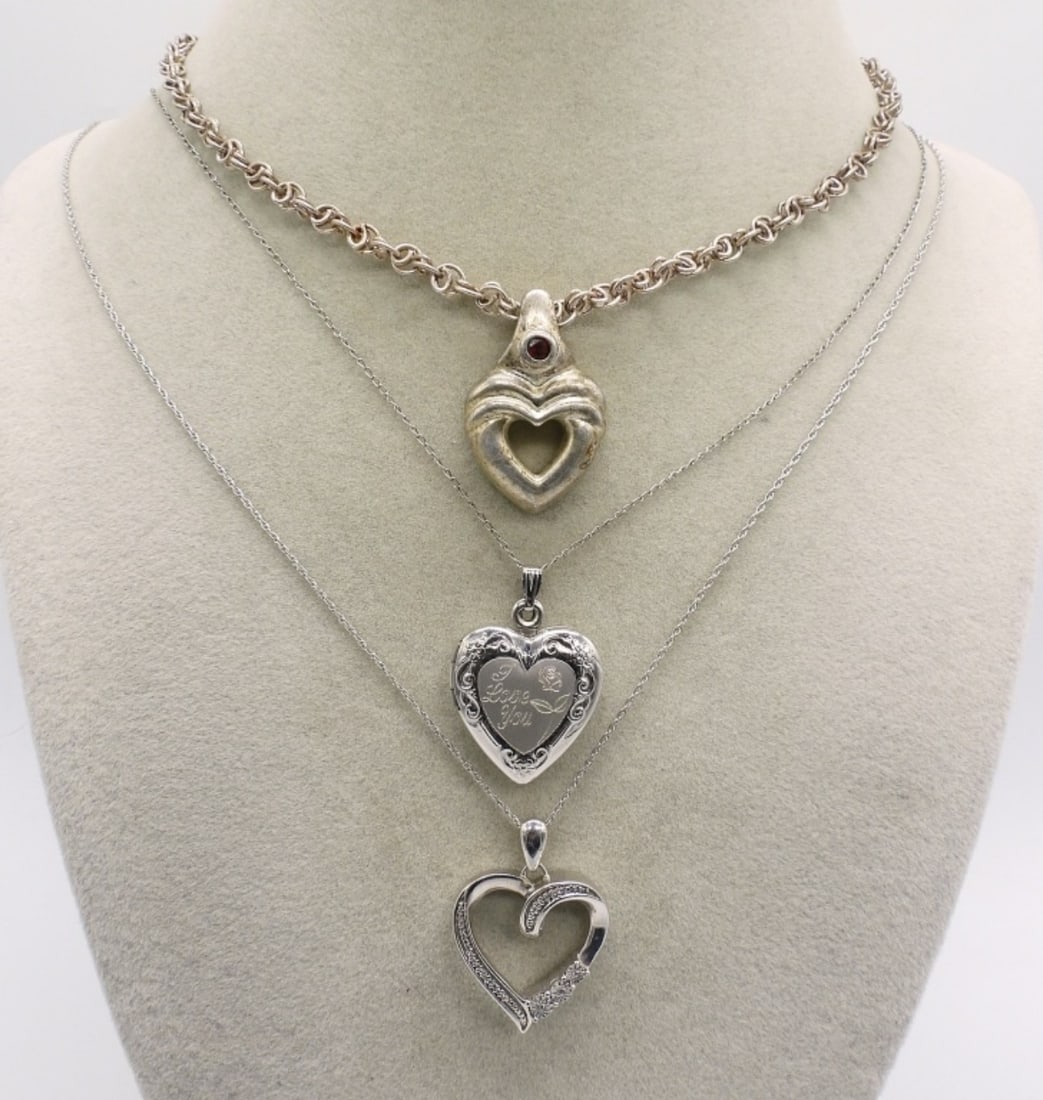 3 Sterling Heart Shaped Fashion Necklaces: Three sterling heart shaped fashion necklaces, 18" & 20". (16 dwt)