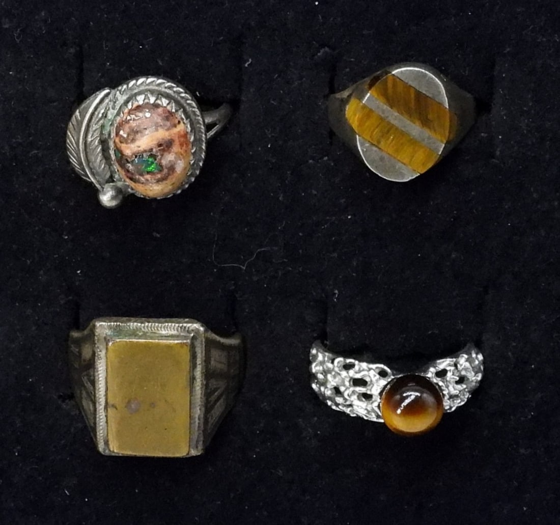 4 Sterling Rings, Tigers Eye, Fire Opal & More: Four sterling rings, sizes 5, 6, 8.5. Mexican Fire Opal, Tigers eye & Unidentified. (12 dwt)