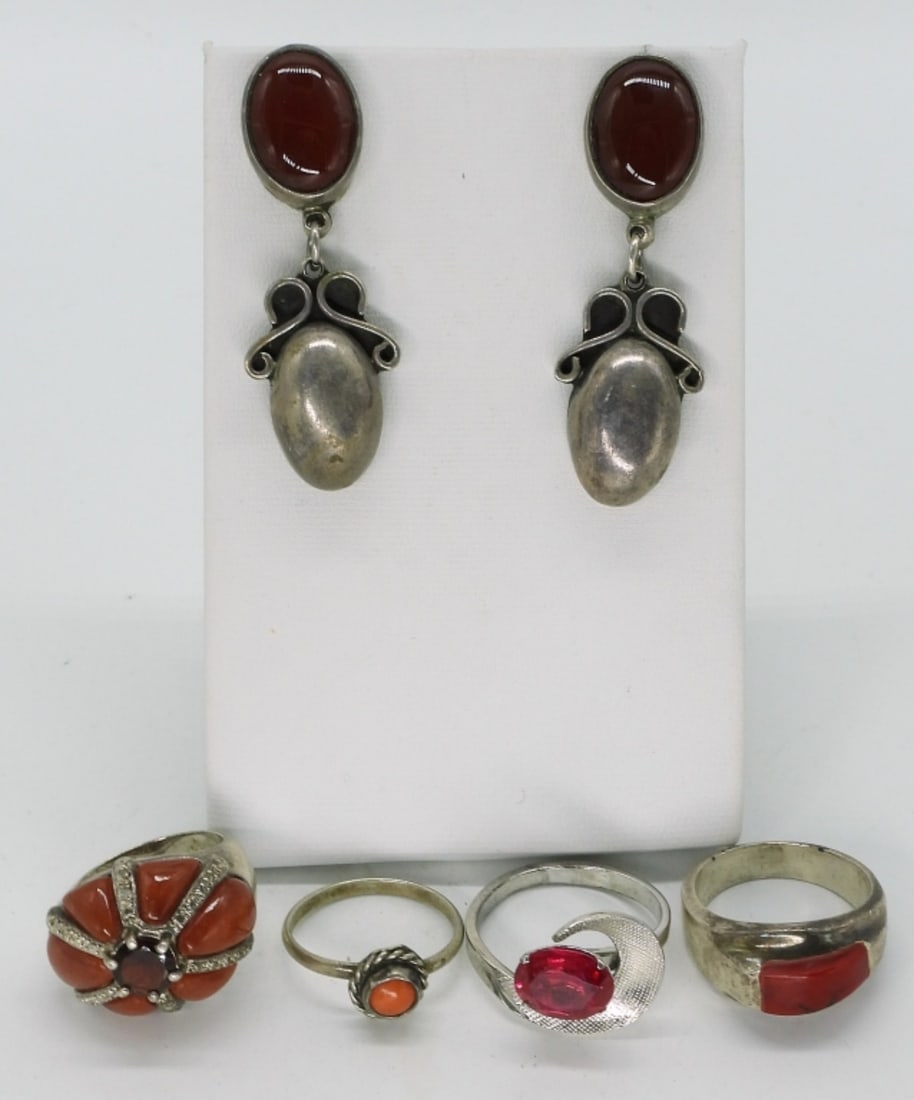 Carnelian, Coral & Faux Ruby 925 Rings: Four sterling rings, sizes 6, 8, 9. One pair of vintage sterling pierced earrings with carnelian gemstones, 2" long. (24 dwt)