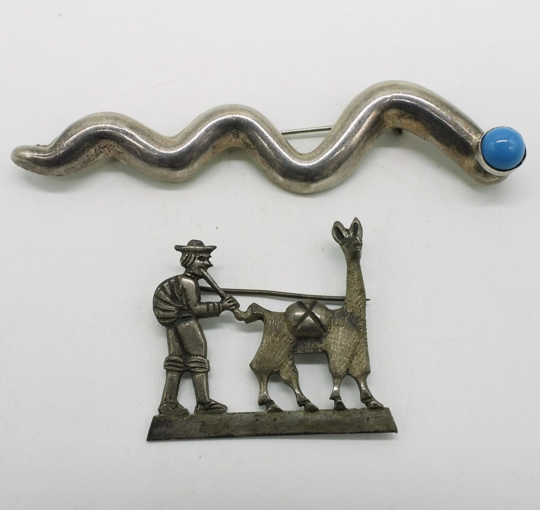 Two Vintage Sterling Brooches: Two southwest style sterling brooches, one has a turquoise gemstone. 1.5" & 4". (11.3 dwt)