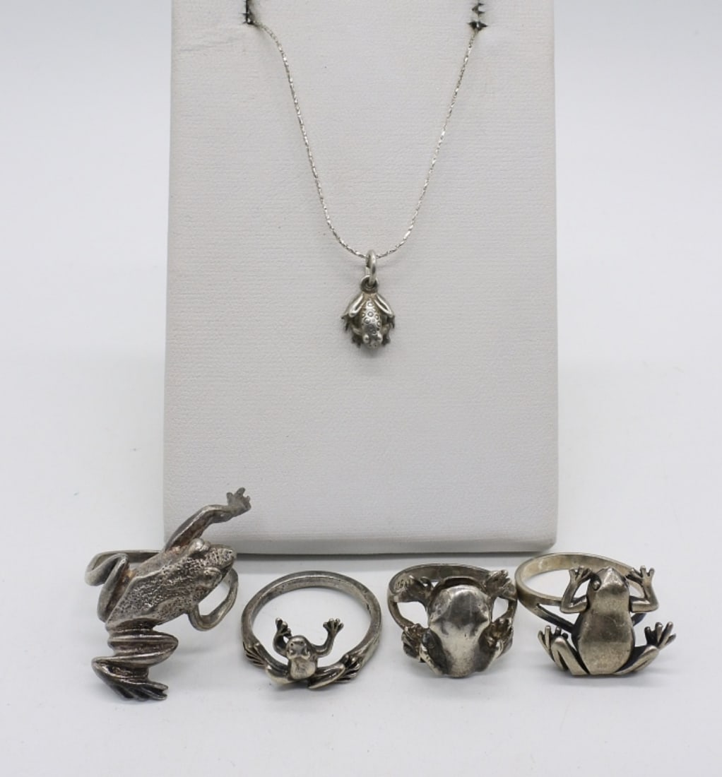 4 Sterling Frog Rings and 1 Necklace: Four sterling frog rings, sizes 6-8. Tiny frog pendant on a 18" sterling chain. (12.4 dwt)