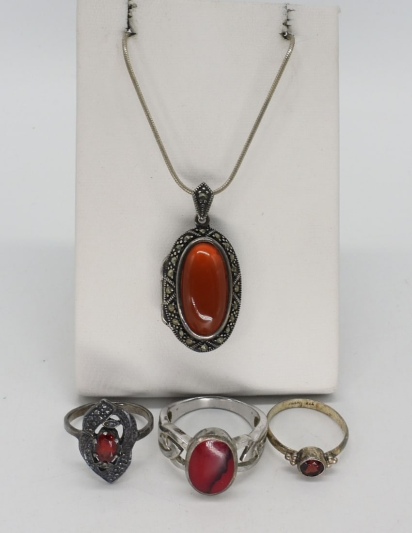Carnelian, Garnet, Red Jasper 925 Jewelry: Carnelian sterling locket necklace, 18" long. Three sterling rings with garnet and red jasper gemstones, sizes 5.5, 6, 9. (14 dwt)