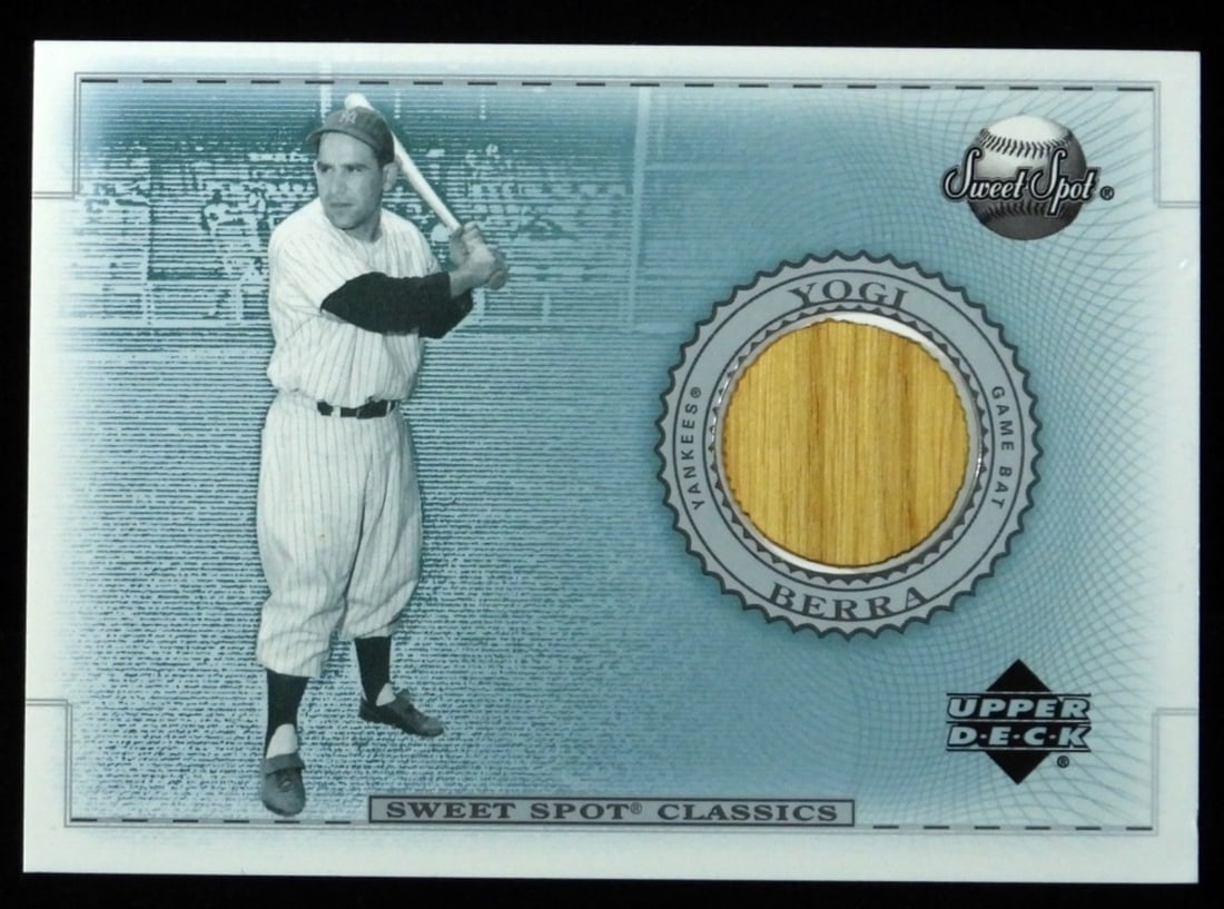 Yogi Berra Sweet Spot Classic Upper Deck: Corners are not rounded, no creasing. Has a piece of his bat on the front of the card. Very good condition