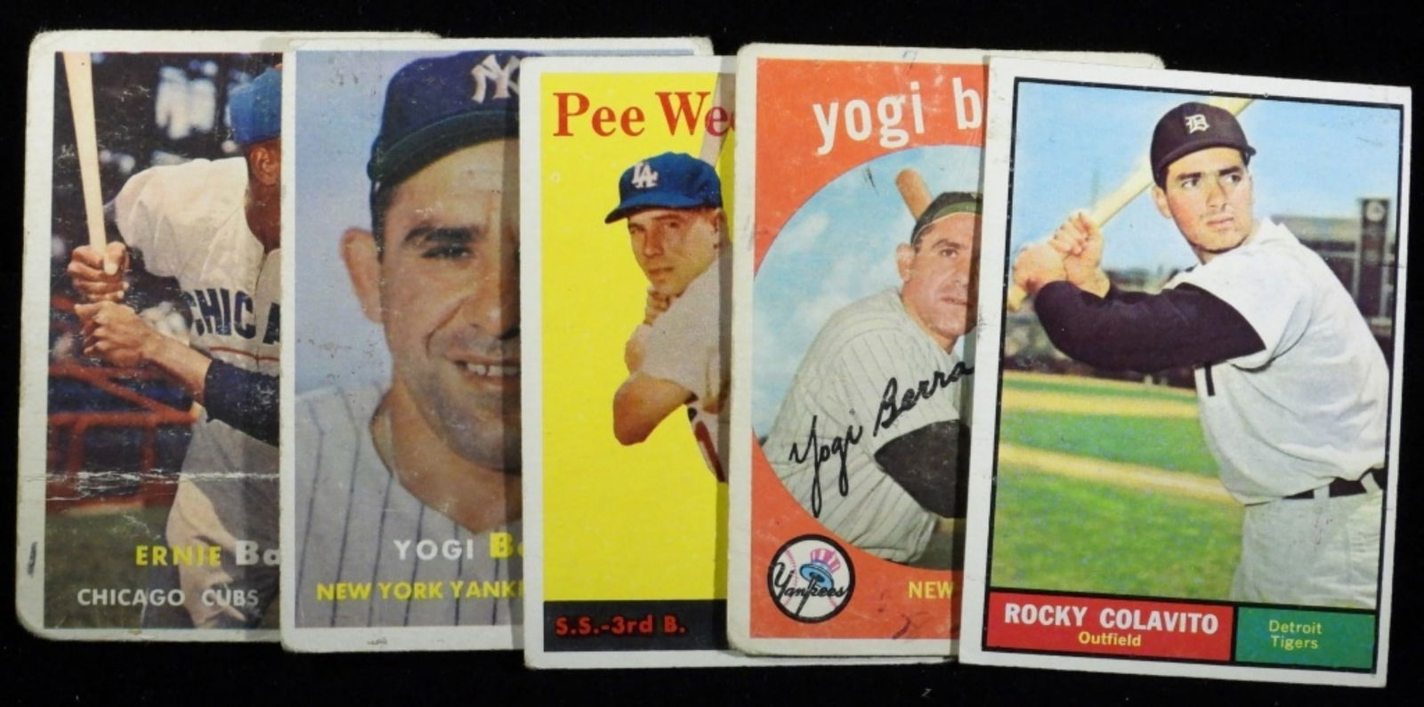 (5) Various Baseball Cards: Rocky Colavito #330: no creasing/no rounded corners. Yogi Berra #180: Some creasing, rounded corners. Pee Wee Reese #375: Rounded corners/no creasing. Yogi Berra #2: rounded corners/ no creasing.