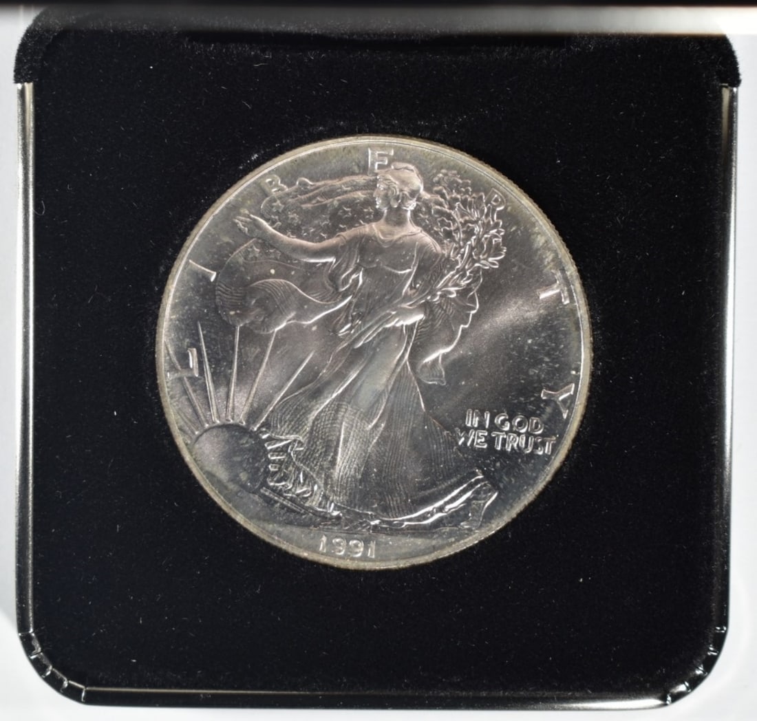 1991 Unc Am. Silver Eagle- Toned: Raw coin in velvet case display