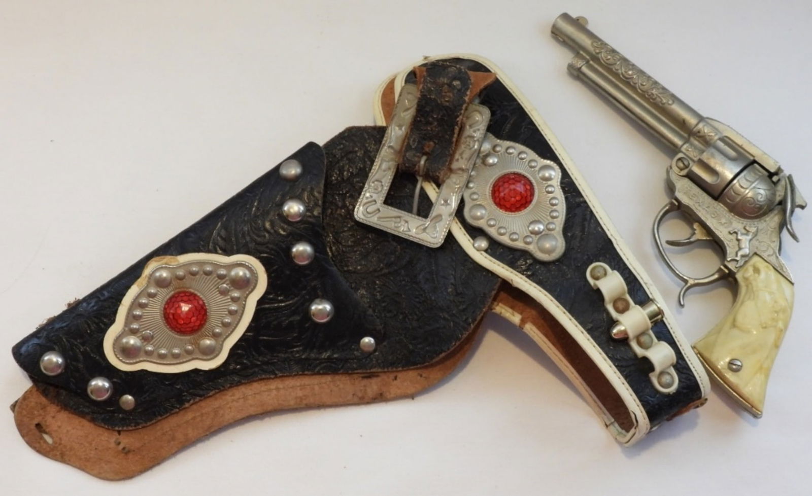 Cap Gun With Holster: Both a little worn but still have life left in them.