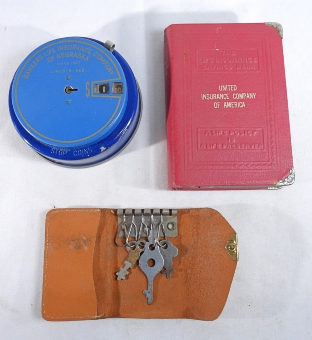 Lock Banks: One book shaped and one round coin banks with original keys in pouch