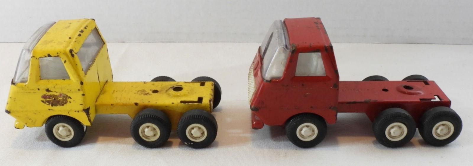 (2) Miniature Tonka Trucks: In poor condition. Paint is peeling, windshield has holes in them.