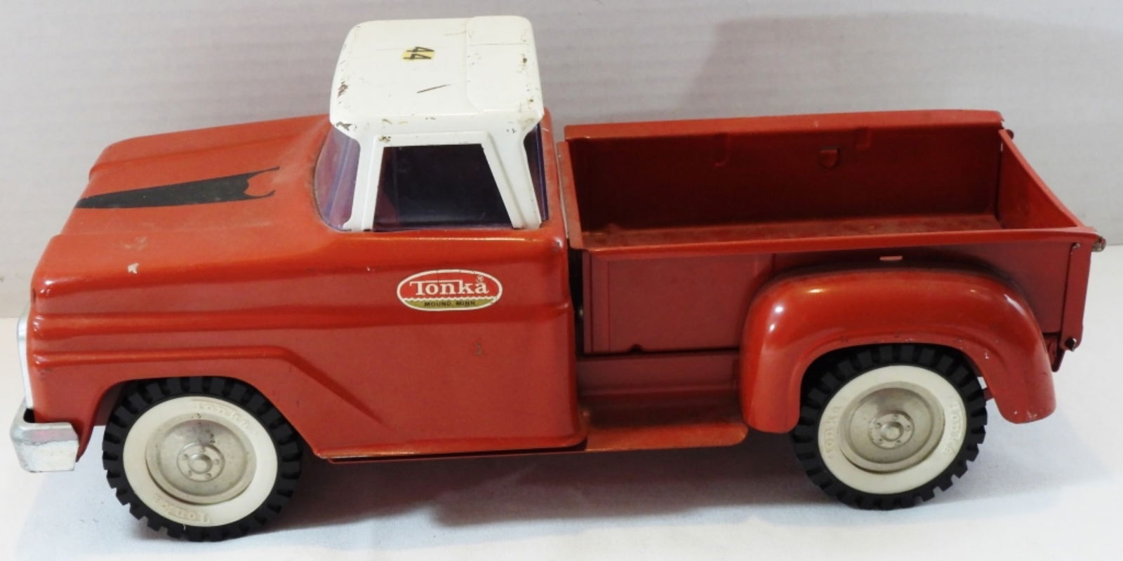 Red Stepside Tonka Pickup Truck: Has some scuffs on it, in good condition