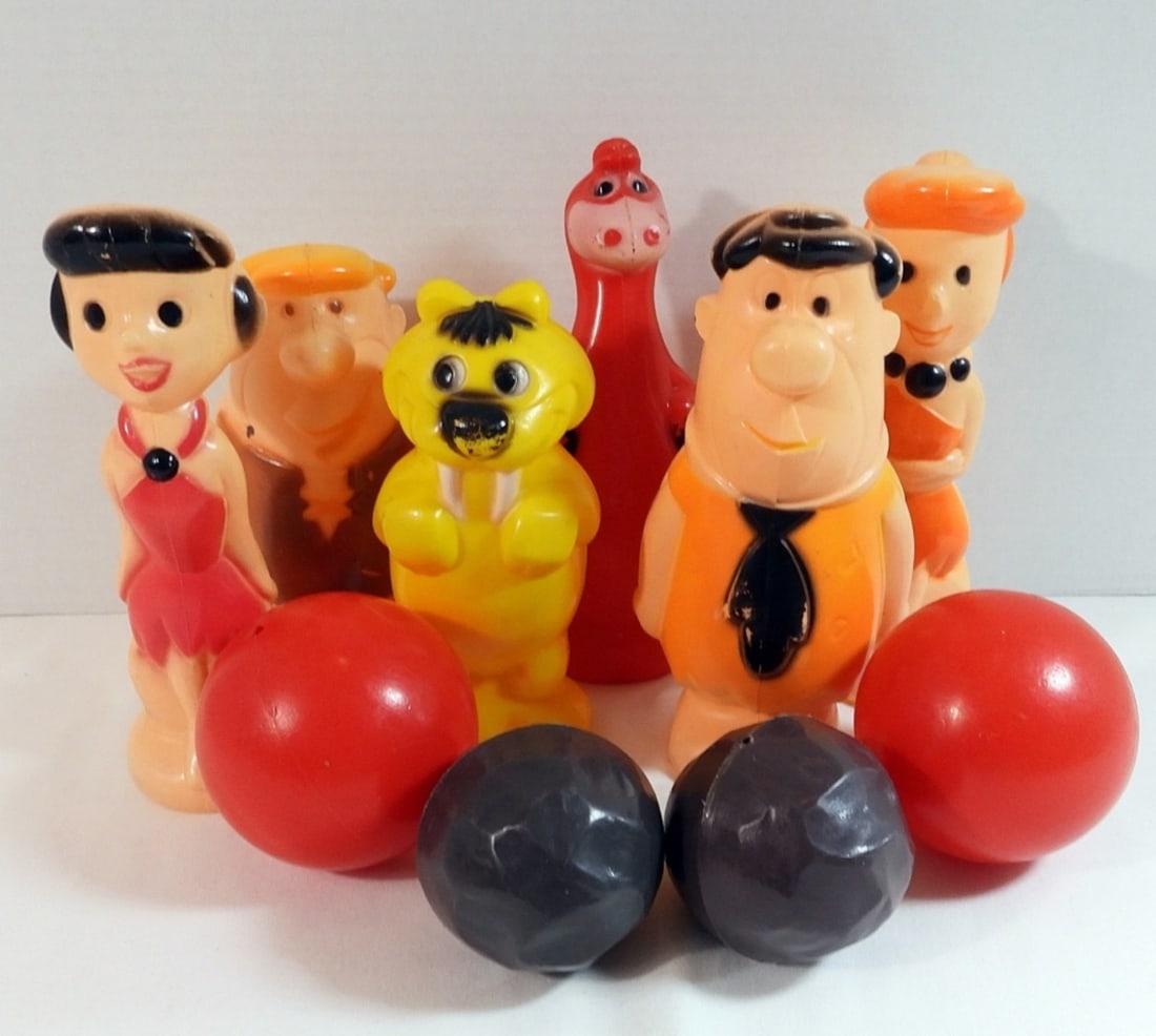 Flintstone Bowling Set: In good condition, some of the paint is coming off on some of them. Balls are in good condition