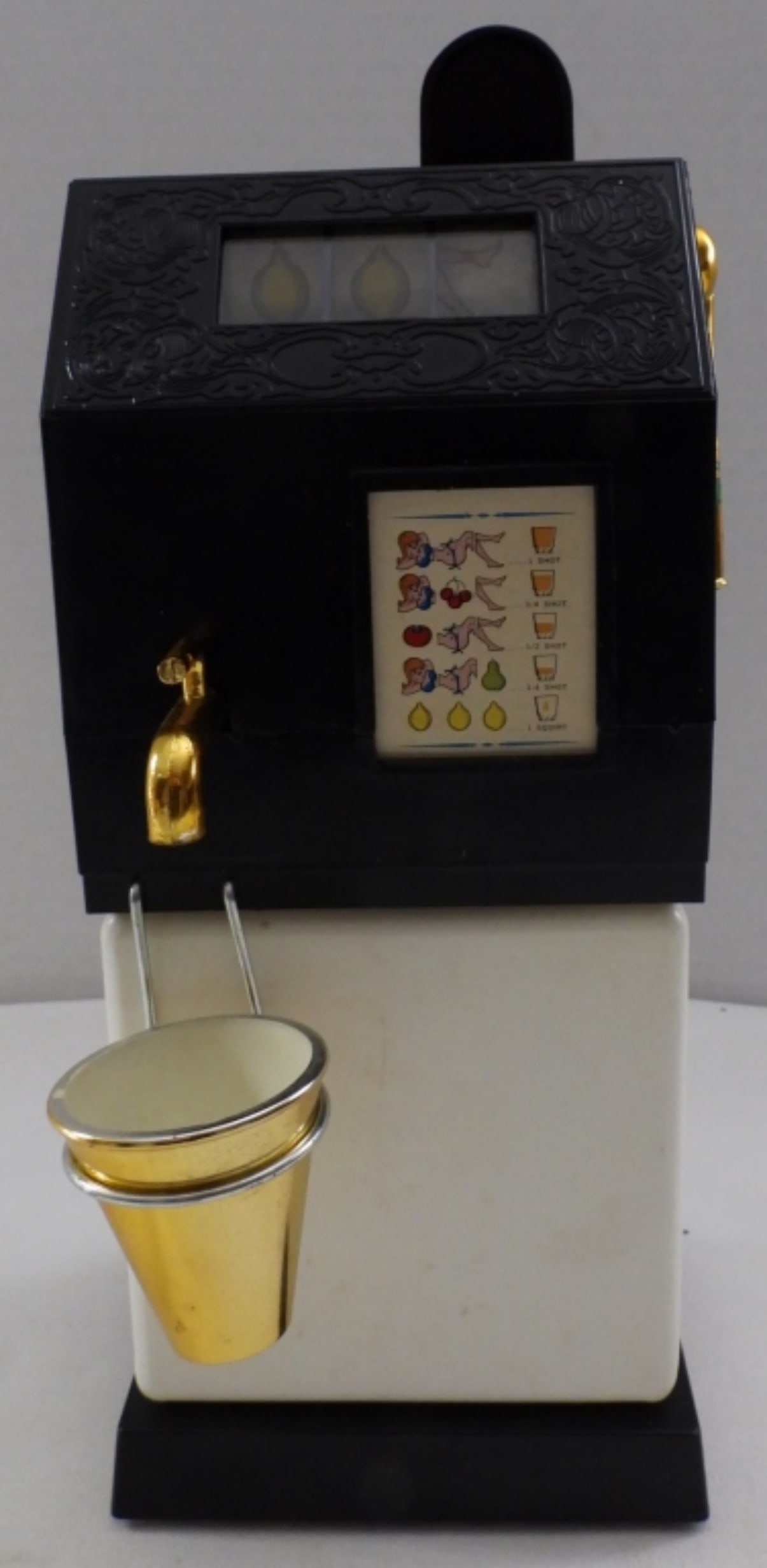 One-Armed Boozer Slot Machine Works: 1969 Ponyter products, battery-operated, tested and working, handle has flaking paint, 10.5" tall, includes instructions, box in good condition