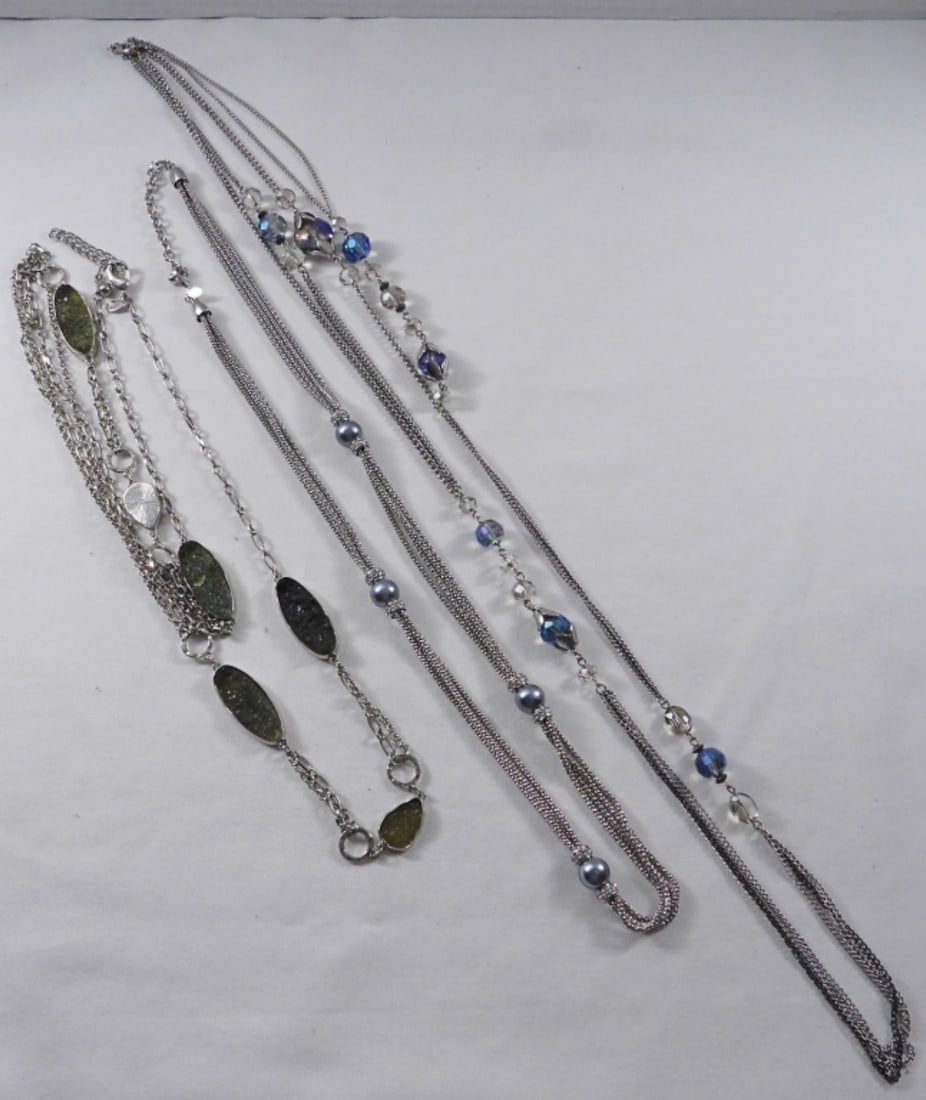 (3) Silver-Toned Necklaces: 3 Silver-toned necklaces (20+") with beads and rhinestone. One of the necklaces has a broken spot.