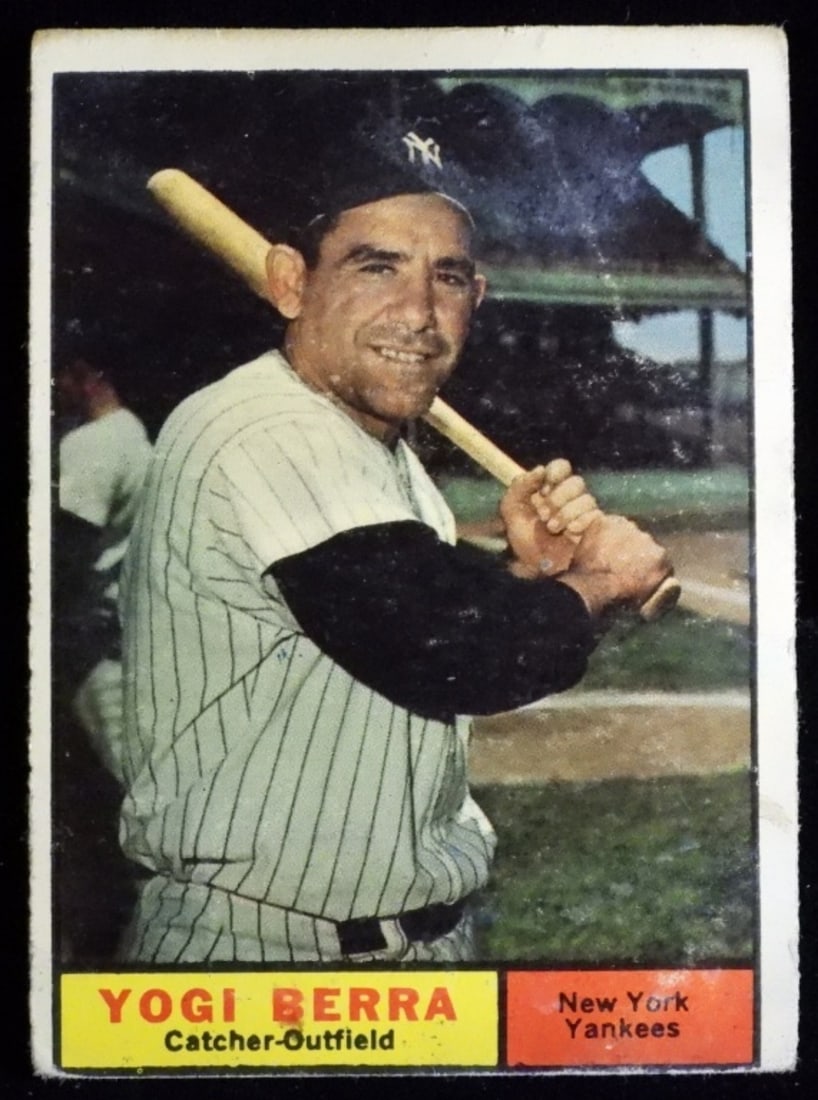 1961 Yogi Berra TOPPS #425: Back is faded a little with some stains. No creasing, corners are rounded.