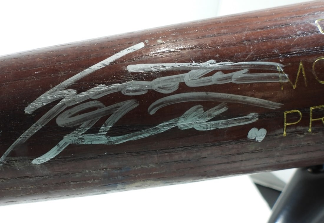 Louisville Slugger Autographed Bat: No COA/ Unverified unless specified. Unknown signature on wooden bat