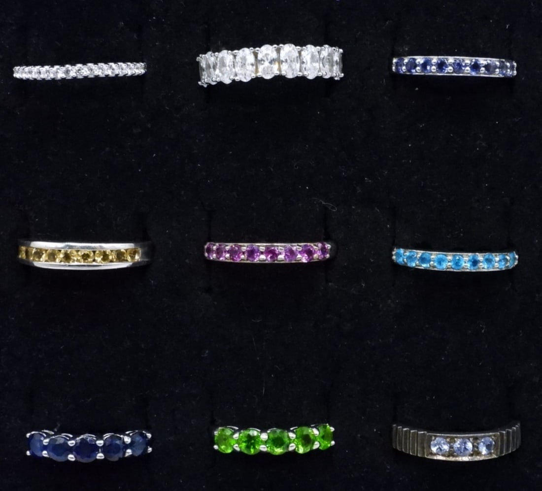 9 Sterling Gemstone Bands: Nine sterling gemstone bands, sizes 6, 7, 8. (14 dwt)