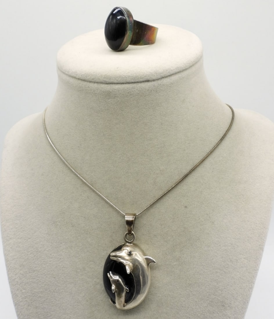 Dolphin Black Onyx Necklace & Ring: Dolphin black onyx and sterling pendant, 2" long. Sterling black onyx ring, size 8. (18 dwt)
